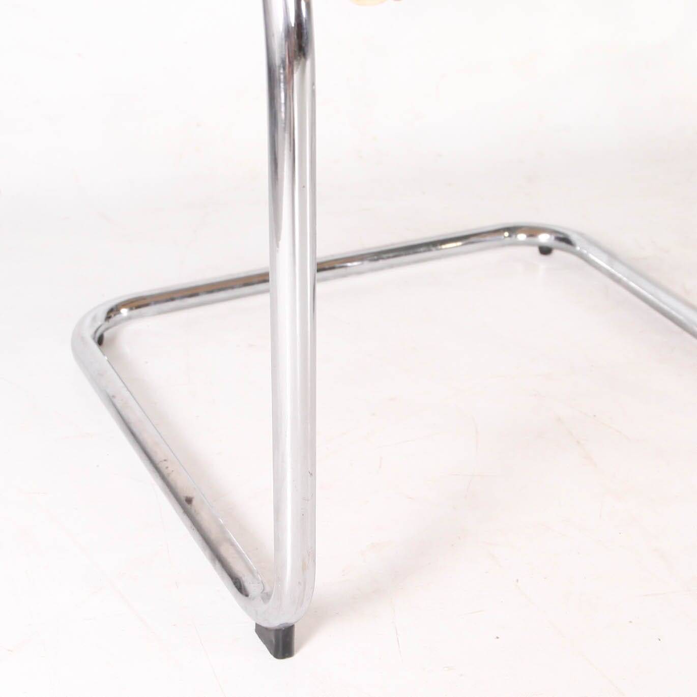 Pair of wicker and metal armchairs