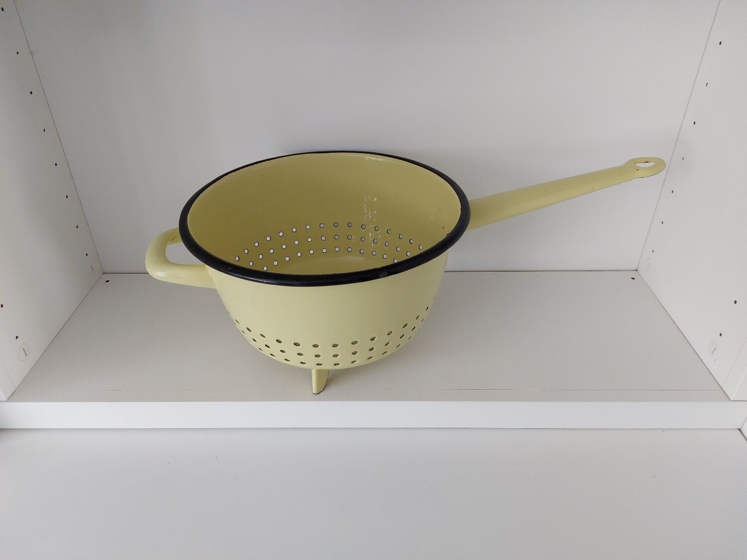 Vintage yellow enamelled strainer