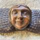 Carved wooden angel head