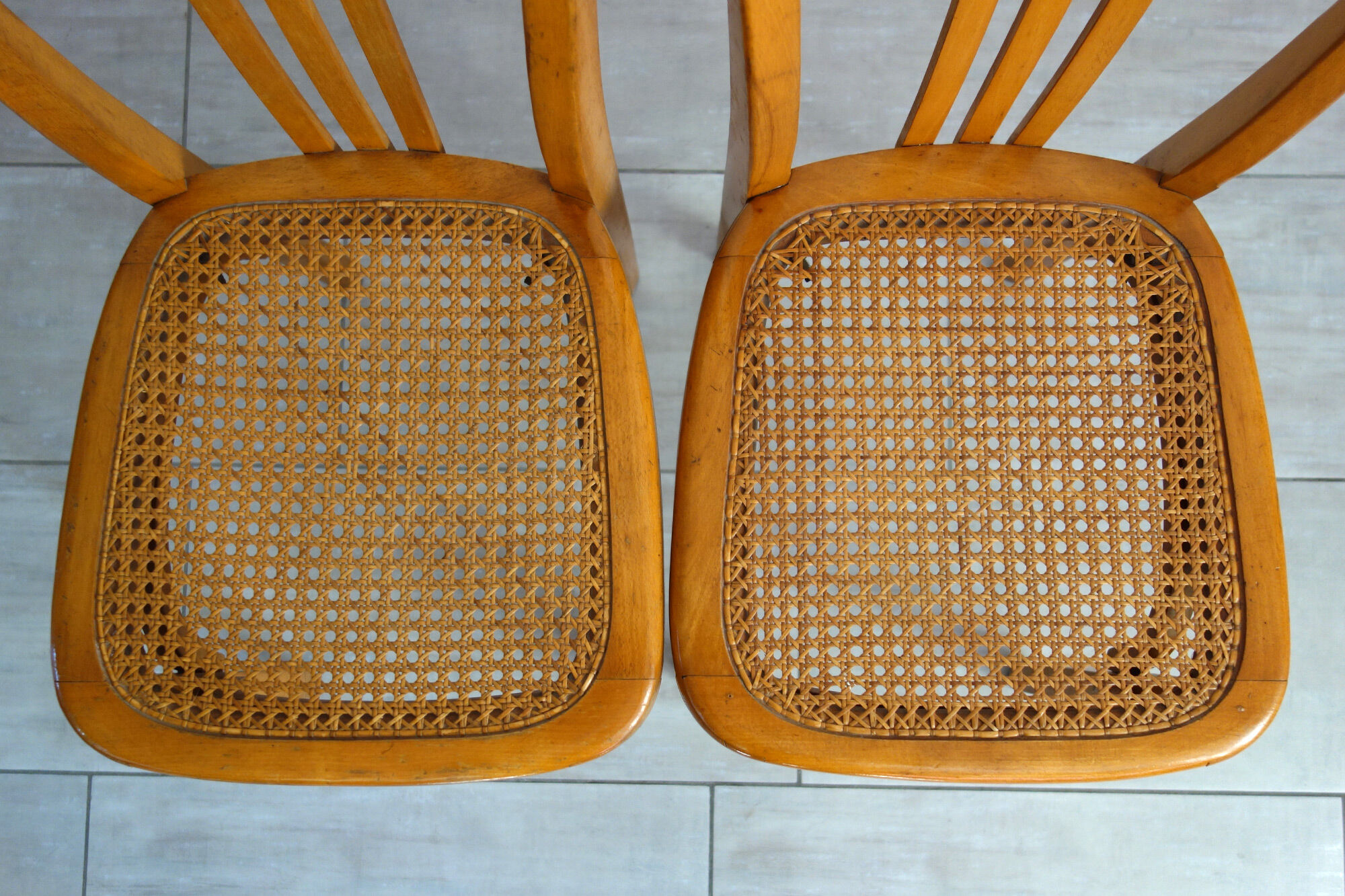 Pair of stella caned bistro chairs, 1930s