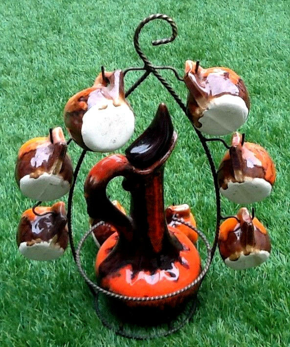 1960s-1970s liquor service including a decanter and 8 cups