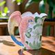 Vintage carafe in animal-shaped barbotine, parrot Ara.