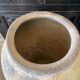 Yellow patinated cement grain jar