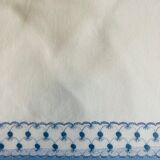 Sheet with blue stripe and embroidered lace