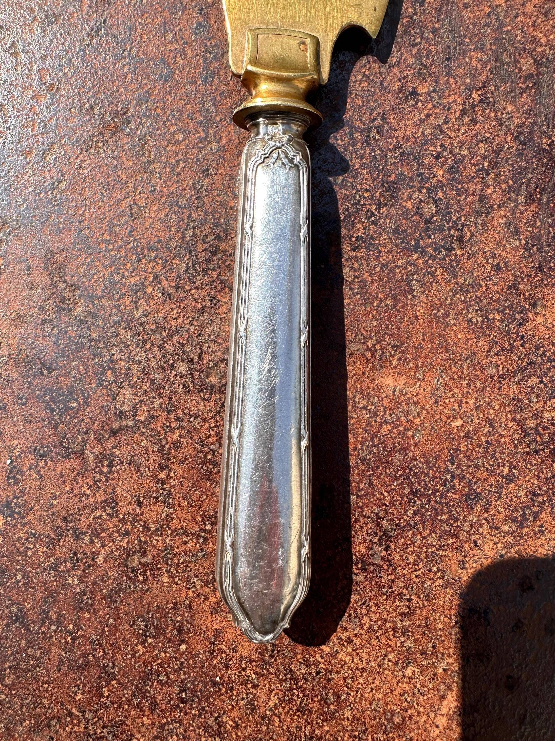 Silver-handled pie server Minerve, golden blade, Louis style.