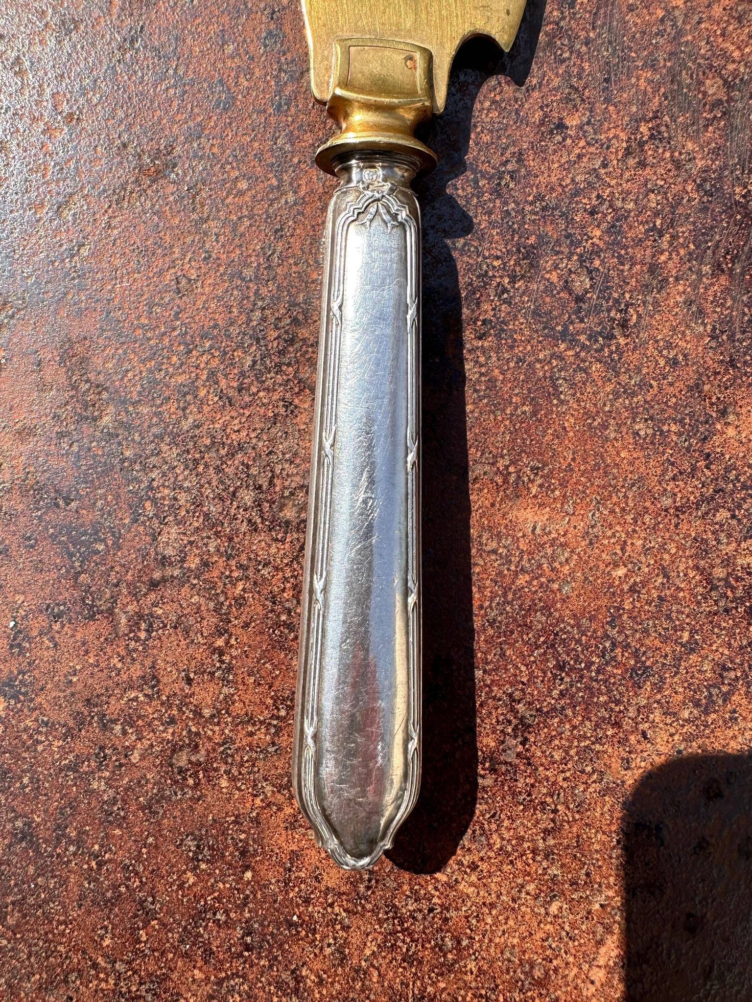 Silver-handled pie server Minerve, golden blade, Louis style.