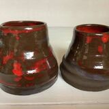 Pair of red vases in the shape of an elephant's foot