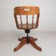 Oak office chair with a spring system and height adjustable, 1930s.