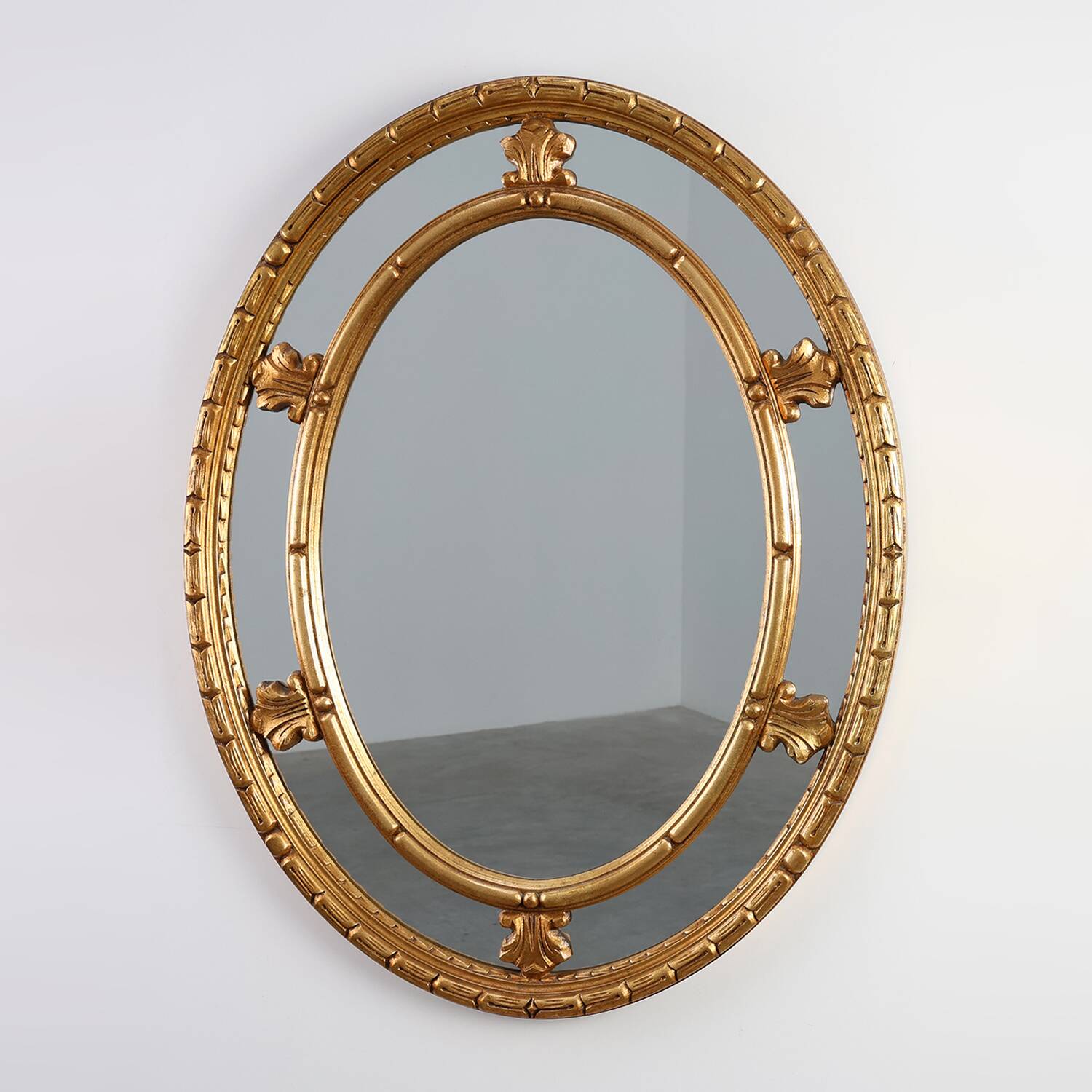 20th century neo-classical style tilted oval mirror by Deknudt, Belgium