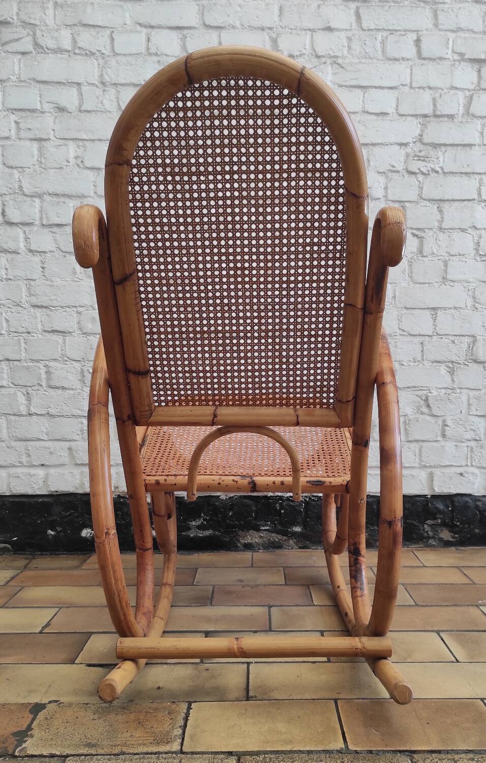 Vintage rocking chair in rattan and cane.