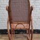 Vintage rocking chair in rattan and cane.