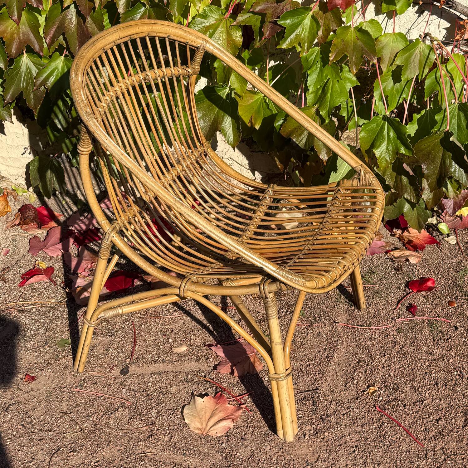 Pair of 1950s rattan armchairs from France.