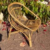 Pair of 1950s rattan armchairs from France.