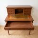 Small vintage wooden desk with a riser.