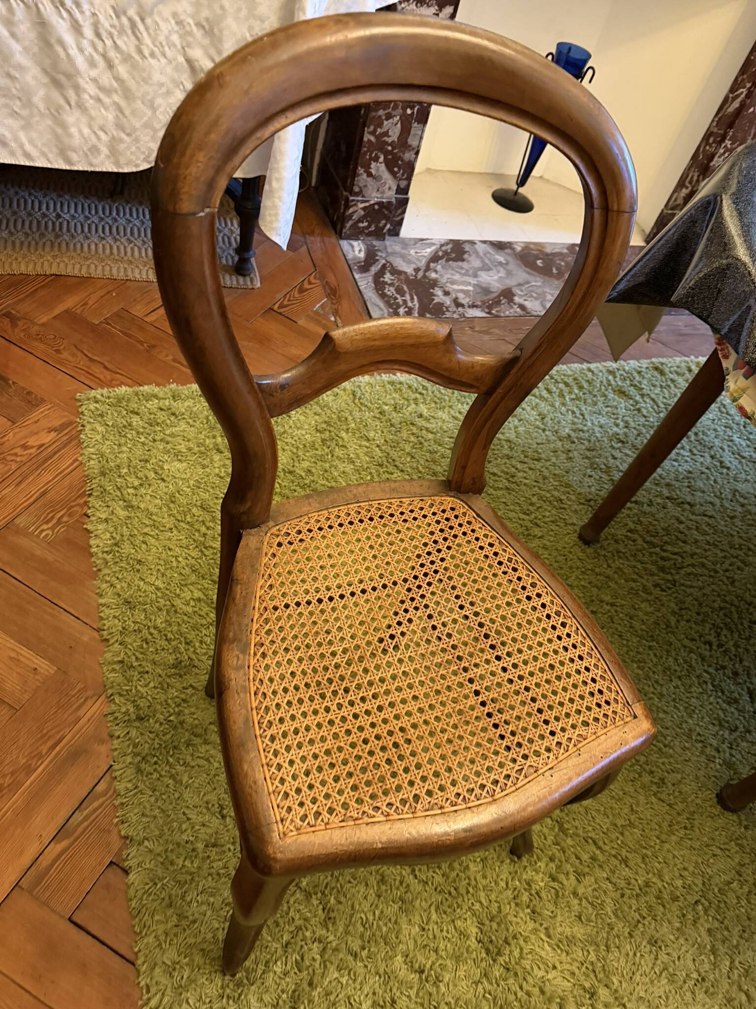 Light medallion chairs and carved fruit chairs.