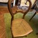 Light medallion chairs and carved fruit chairs.