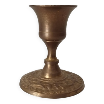Old candlestick in gilded brass
