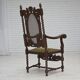 Fauteuil danois à haut dossier des années 1930, en maille, velours et bois de chêne sculpté.