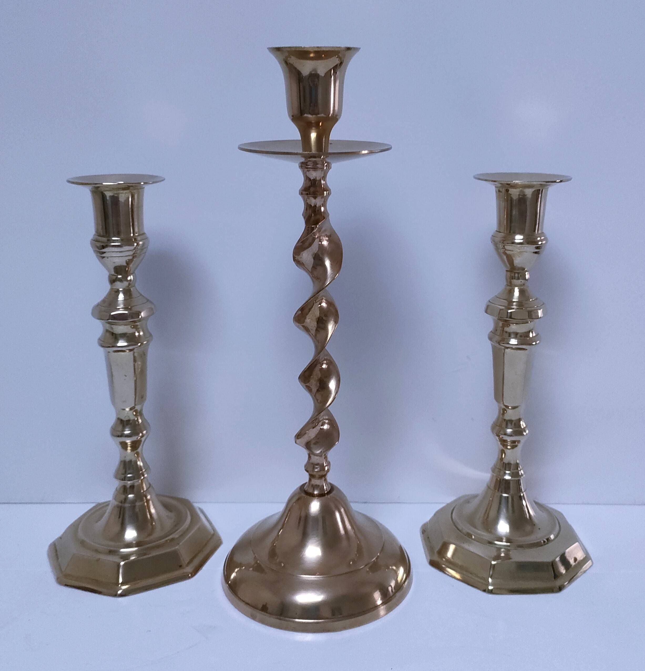 Three vintage solid brass candle holders