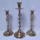 Three vintage solid brass candle holders