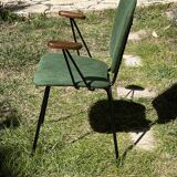 50s chair with armrests.