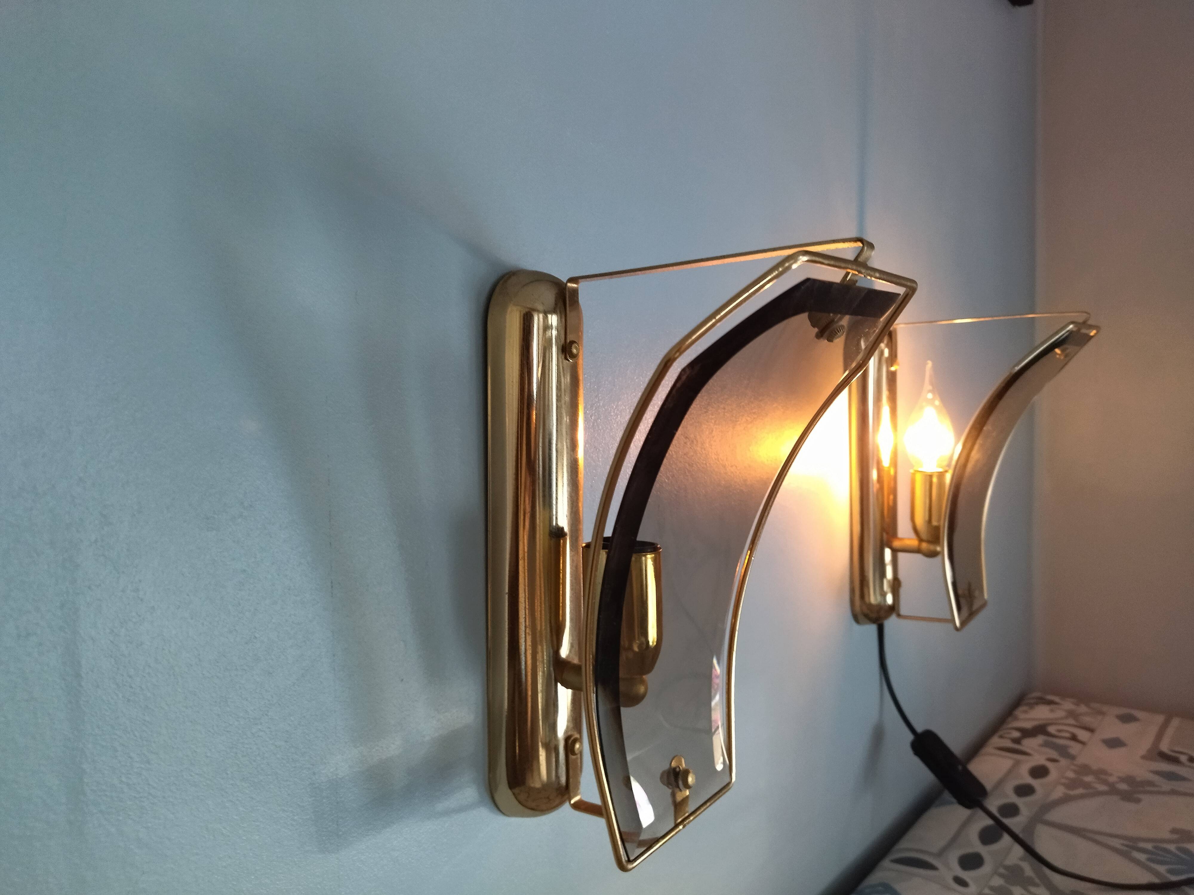 Pair of brass and curved glass wall lamps from the 80s