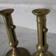 Pair of brass pusher candlesticks