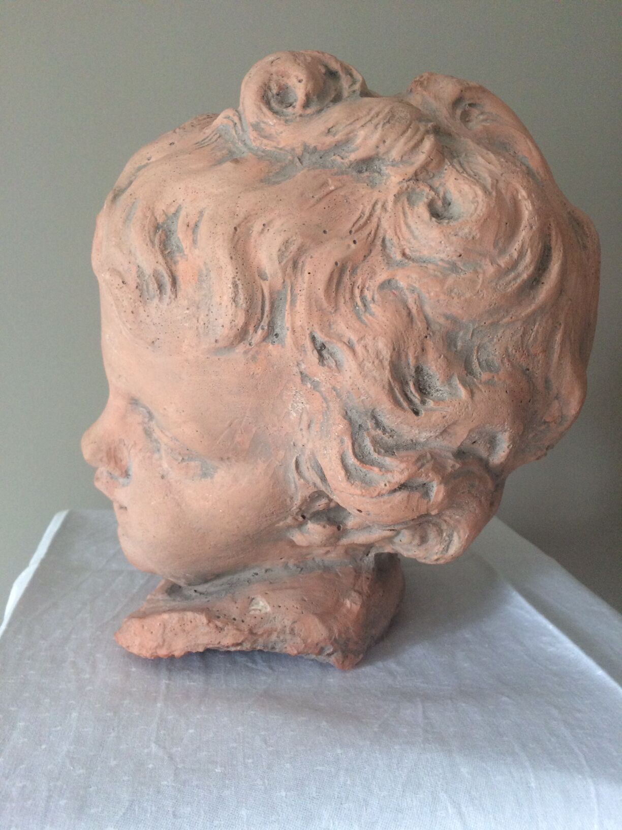 Child bust in plaster