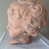 Child bust in plaster