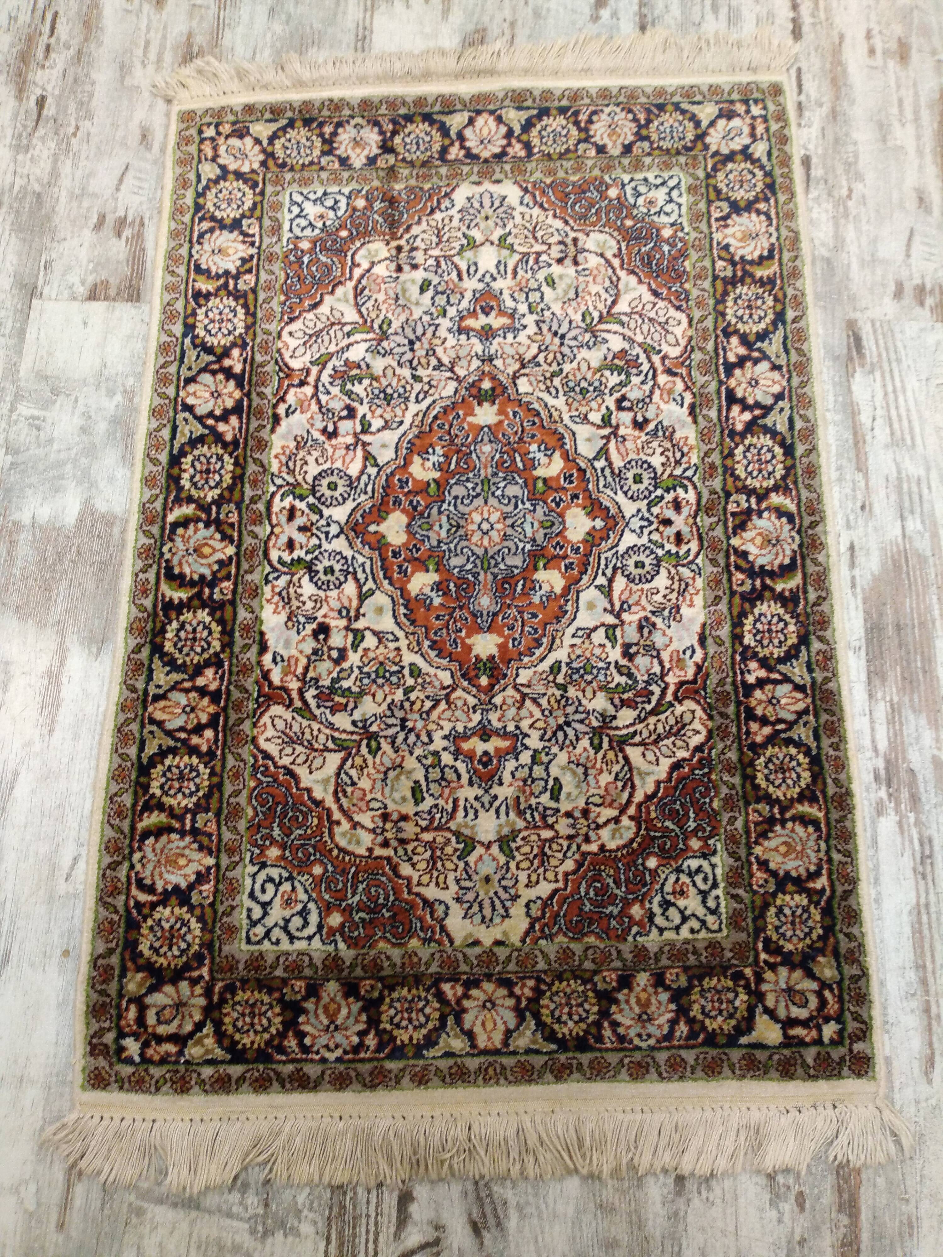 Handmade Persian wool and silk rug