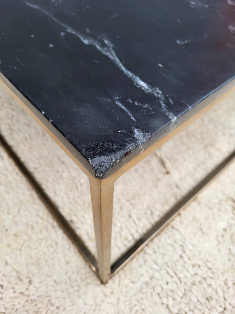 Coffee table or black marble and brass display "in its own juice"