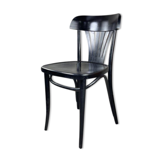Black bistro chairs with palmette