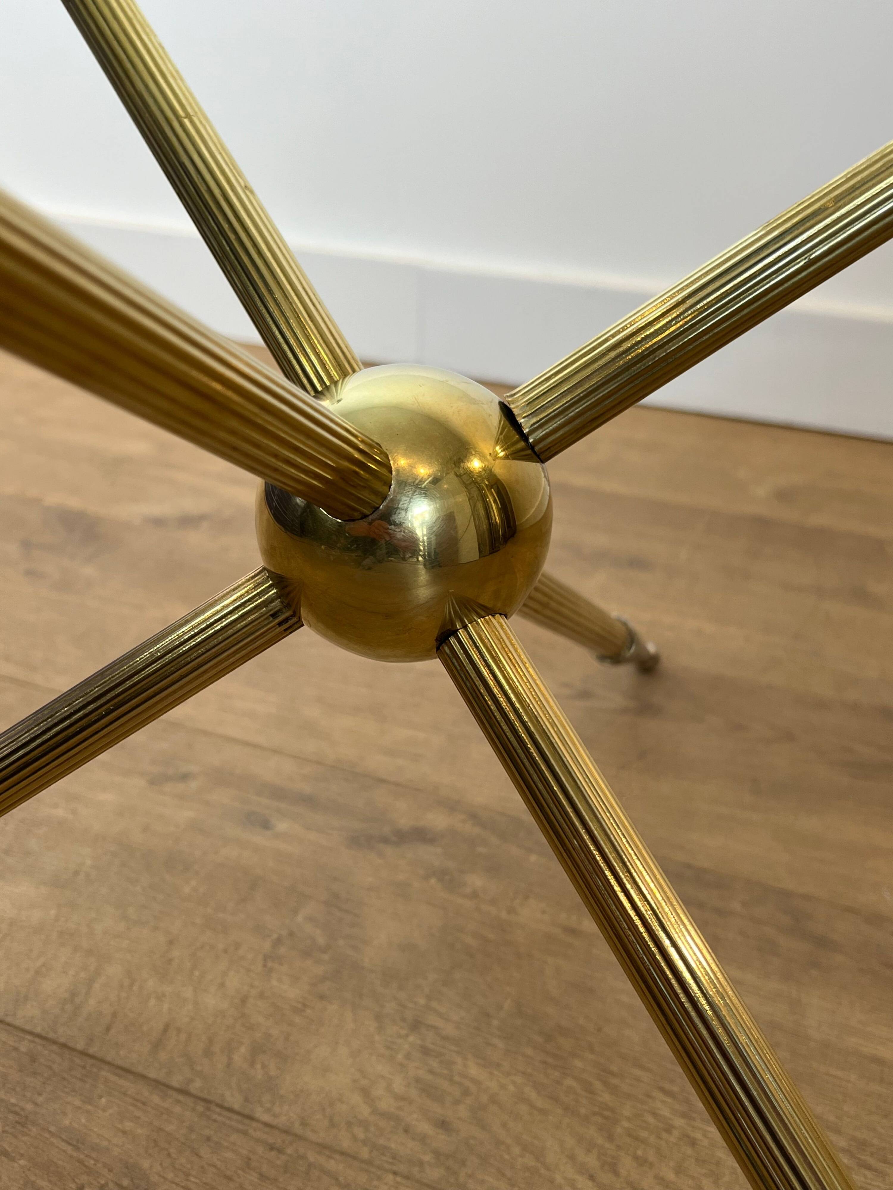 Round tripod designer coffee table in brass