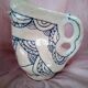 Zoomorphic pitcher in enamelled terracotta