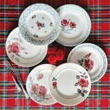 Old mismatched earthenware dinner plates accompanied by a deep dish