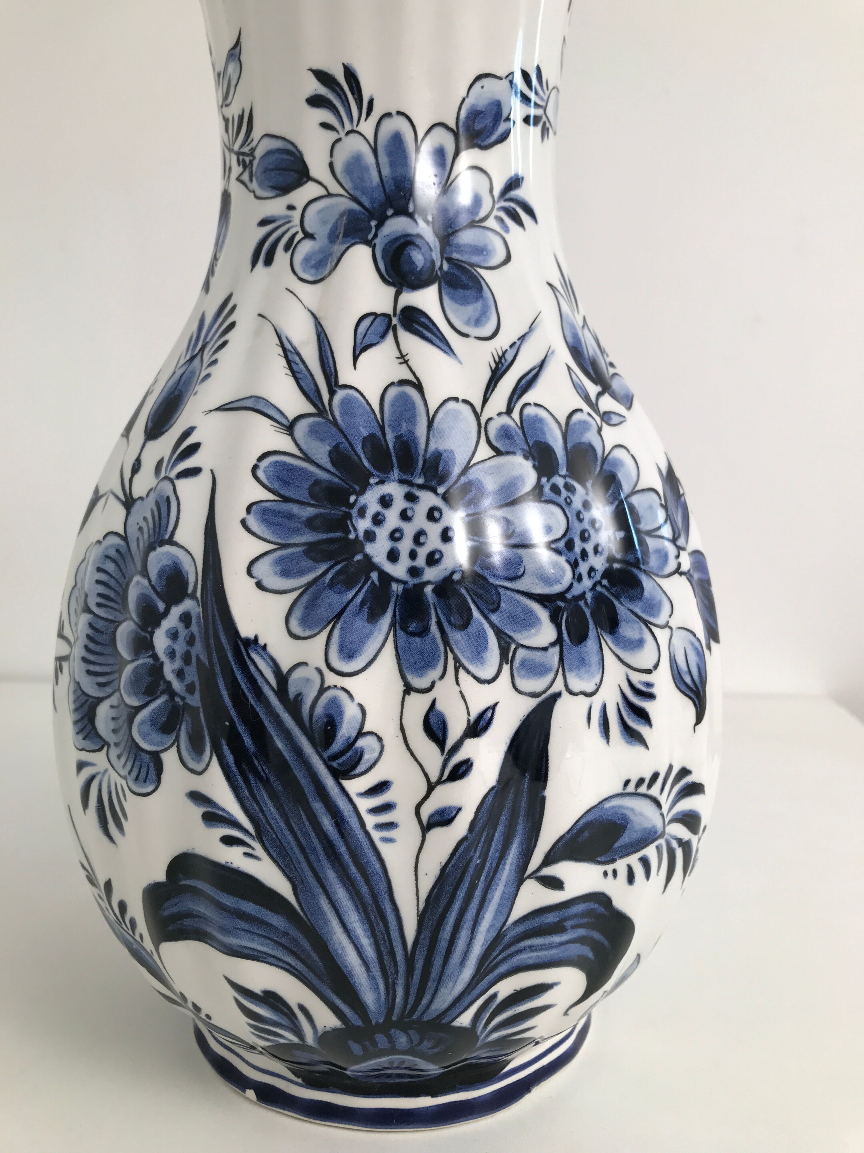 Vase with vintage blue and white flower pattern signed