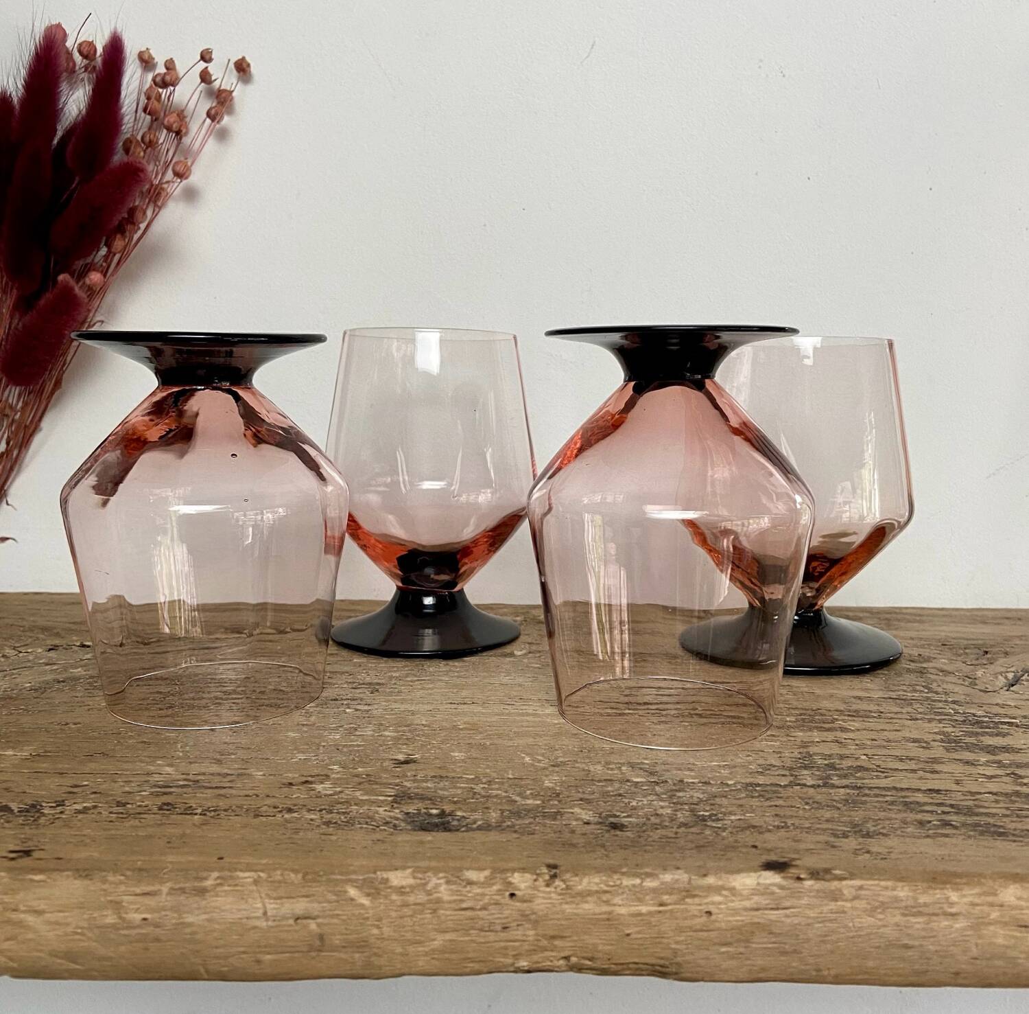 4 pink glasses with black stem