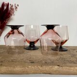 4 pink glasses with black stem