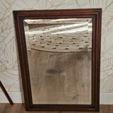 Beveled glass mirror in its wooden frame