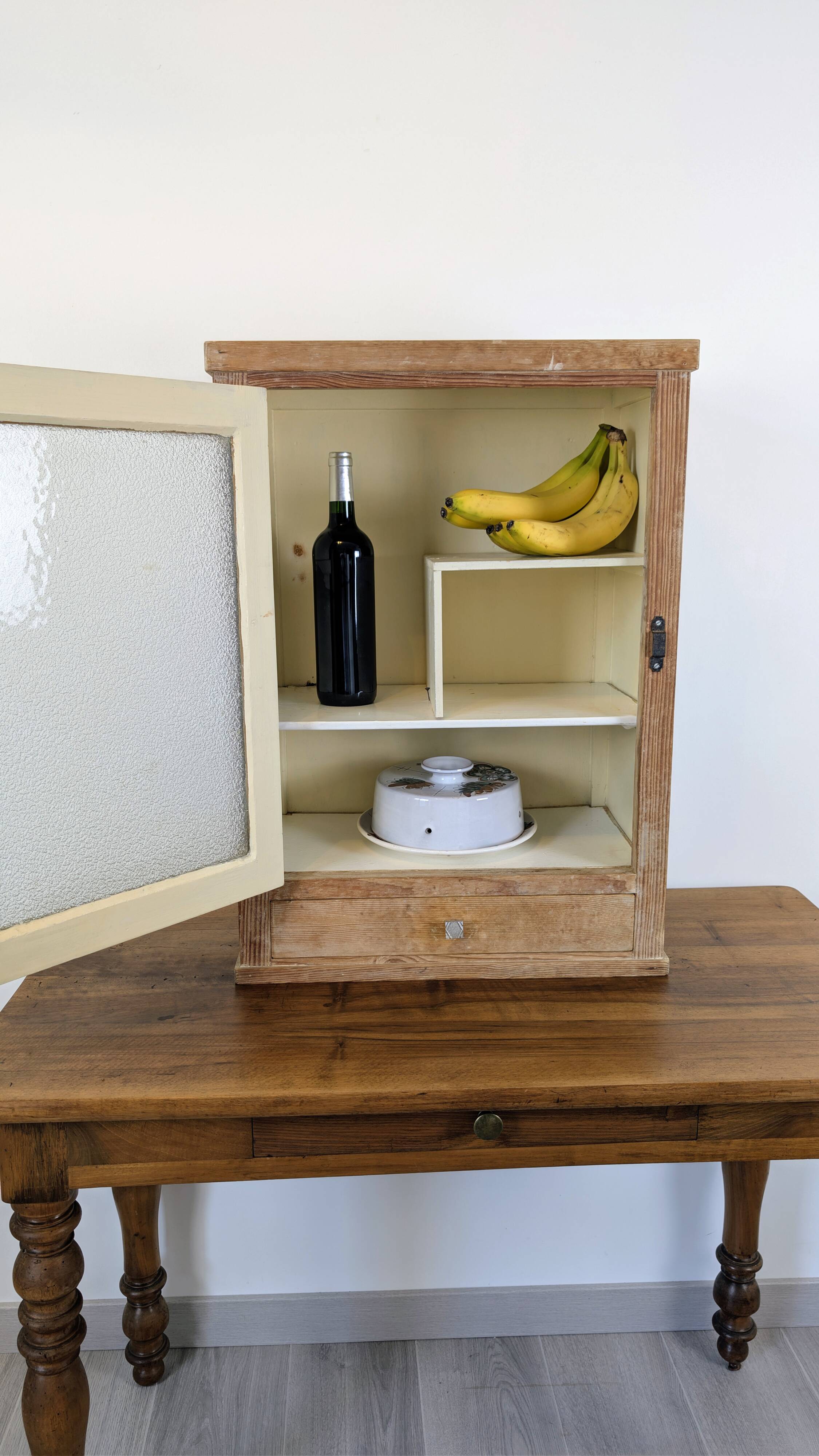 Small glass wall cabinet from the 1960s.