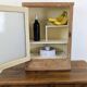 Small glass wall cabinet from the 1960s.