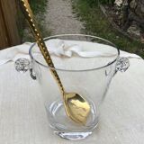 Ice bucket and golden spoon