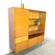 Vintage wooden sideboard with sliding glass doors and drawers