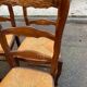 4 Louis XV chairs in solid oak with rush seats, shell carvings, 19th century.