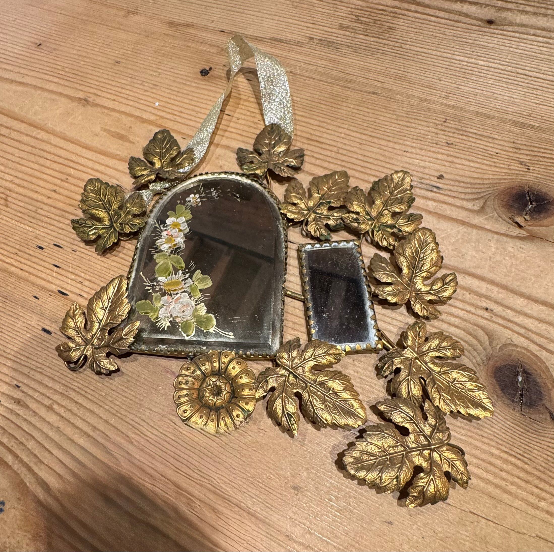 Ornamental brass mirror