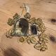 Ornamental brass mirror
