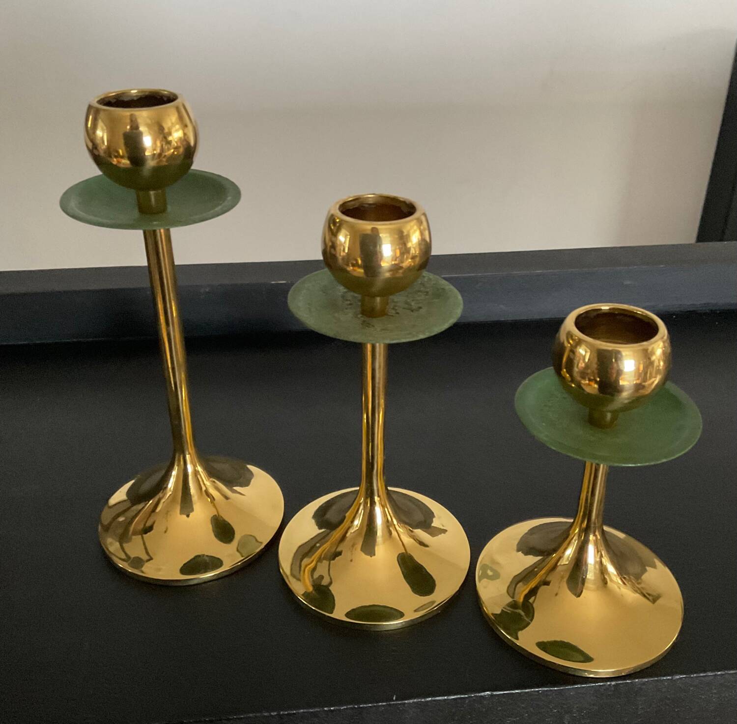 Trio of vintage brass candlesticks