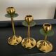 Trio of vintage brass candlesticks
