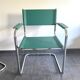 Pair of faux leather and chrome armchairs