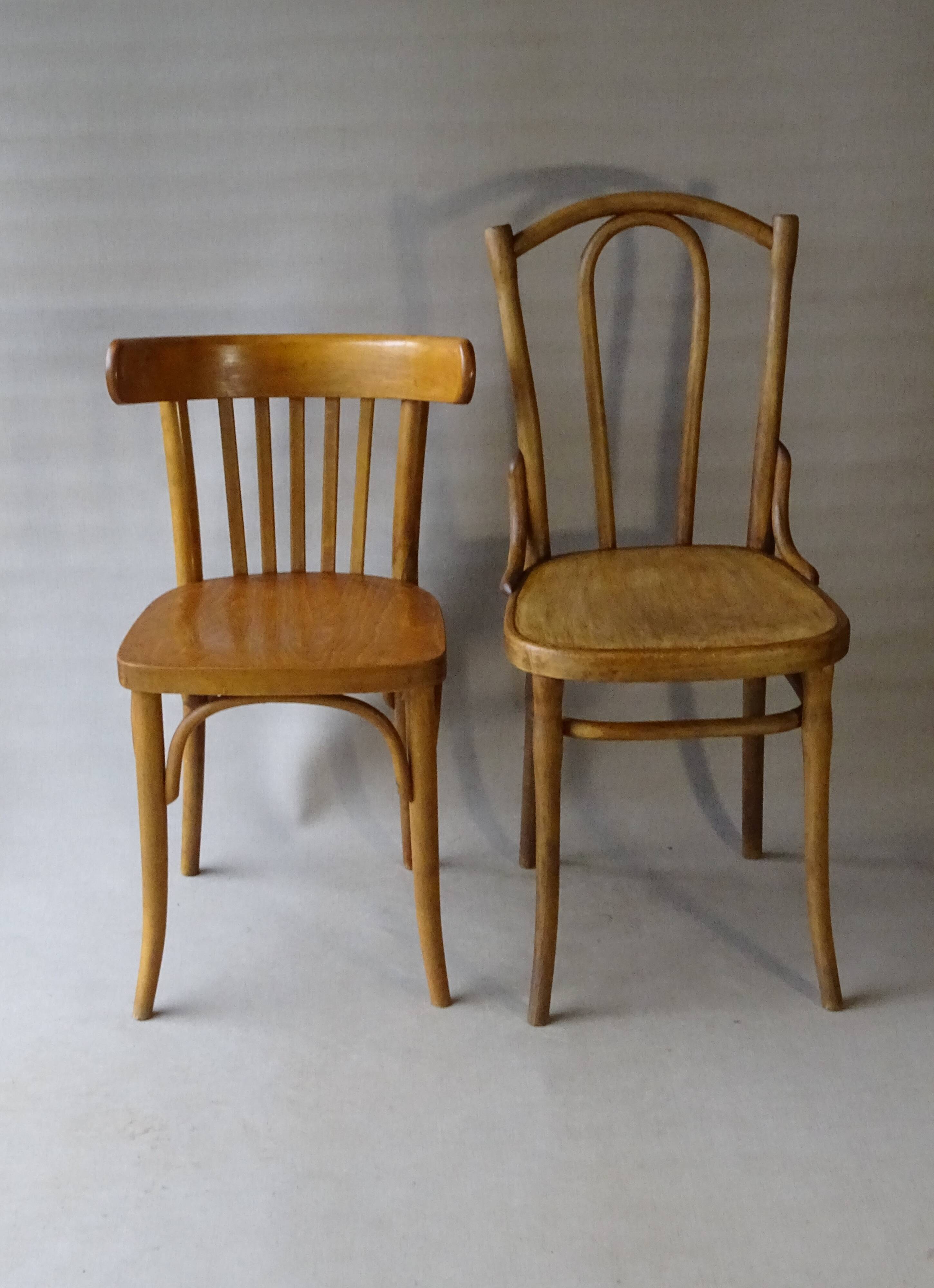 Set of 36 mismatched Bistrot chairs, 1920 to 1950, wooden seats.